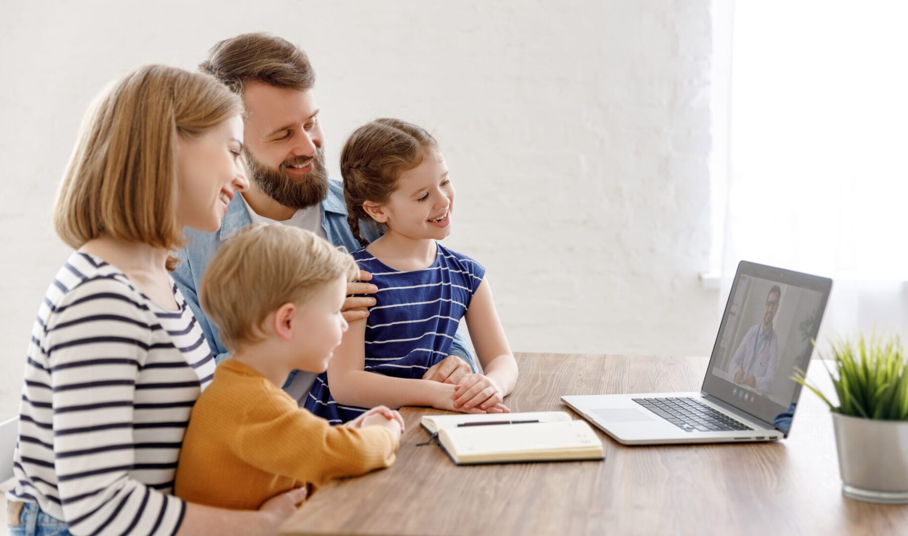 Family video call on a laptop.