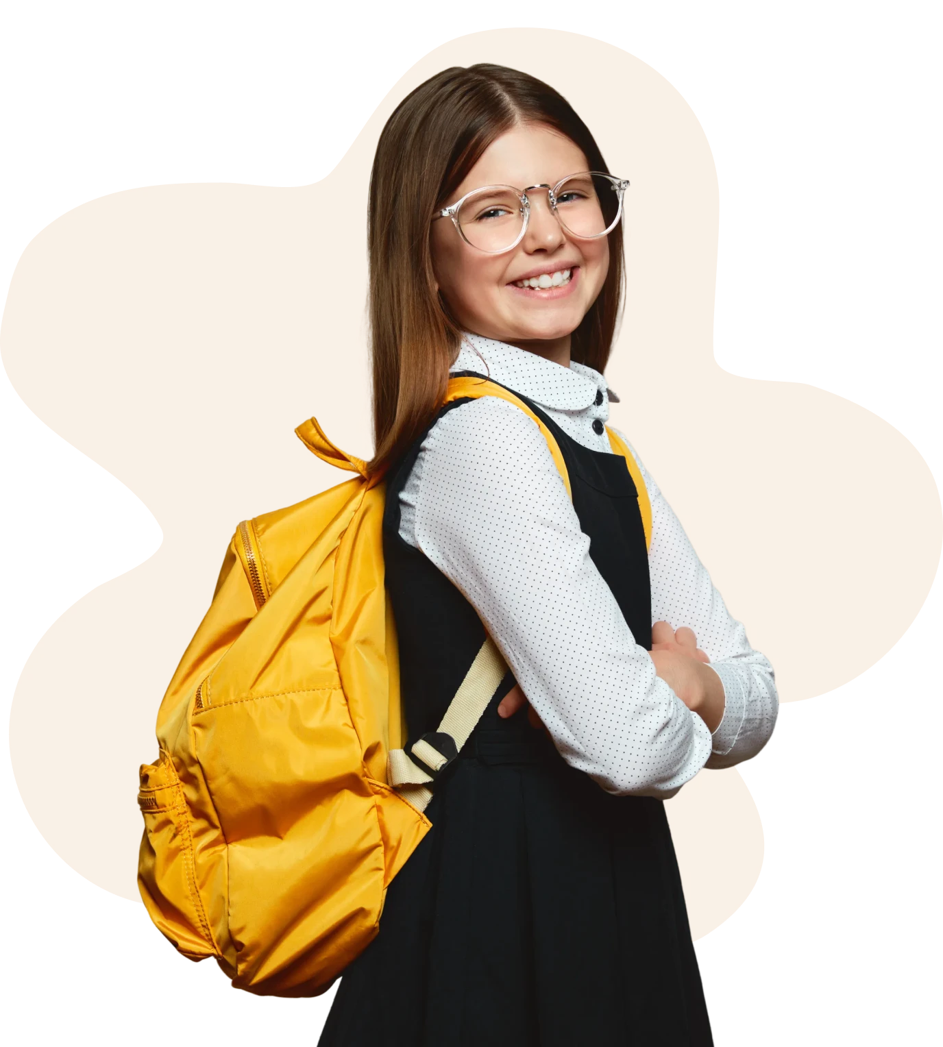 Smiling girl with glasses and yellow backpack.