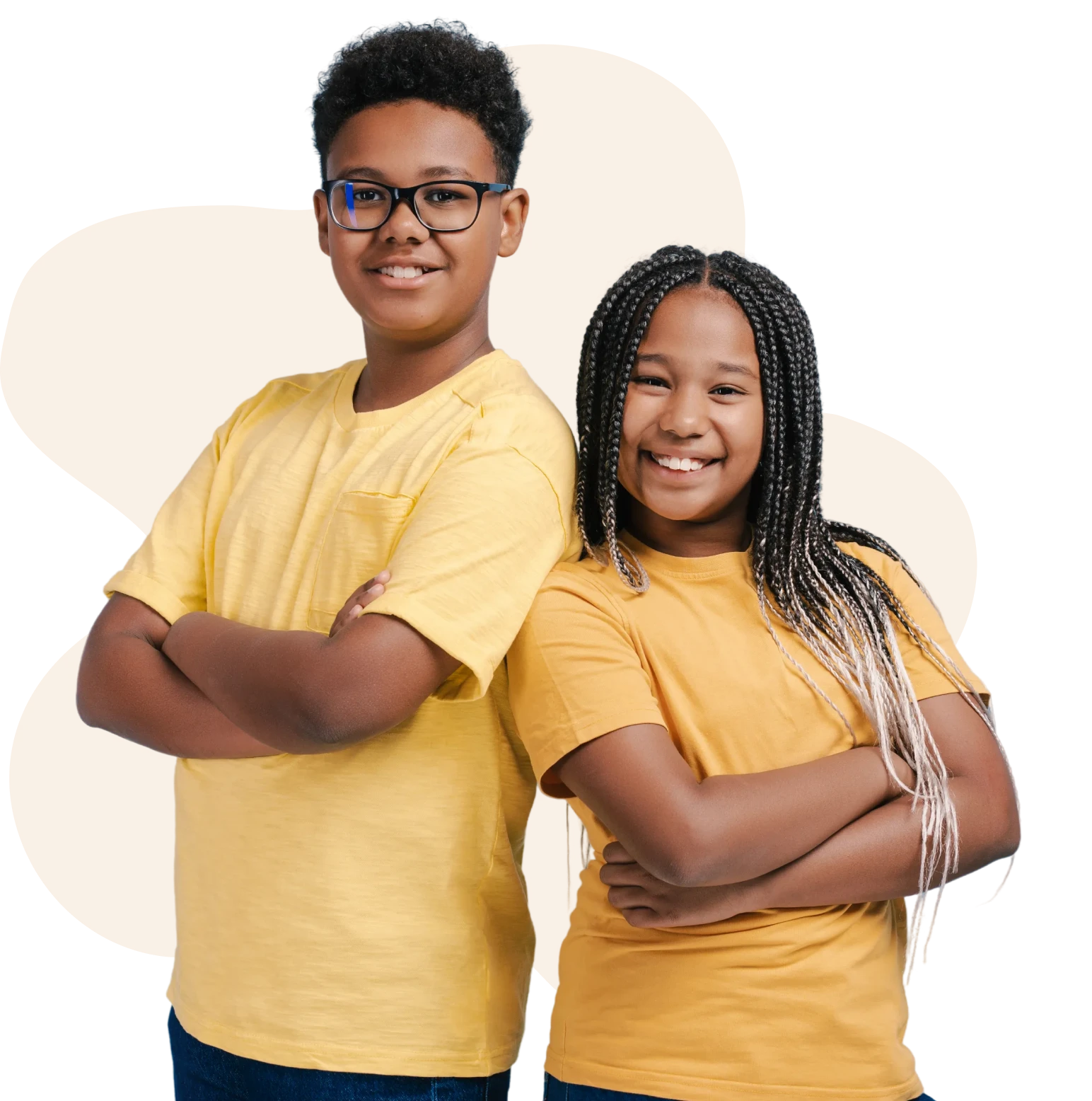 Two smiling kids in yellow shirts.