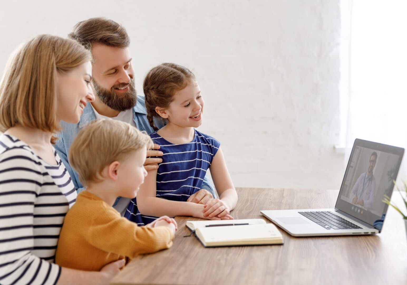 Family video call on a laptop.